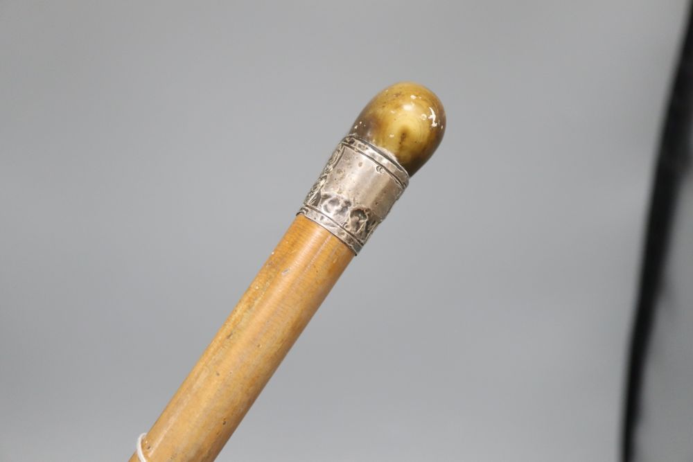 A Chinese horn and silver stick, possibly rhino horn